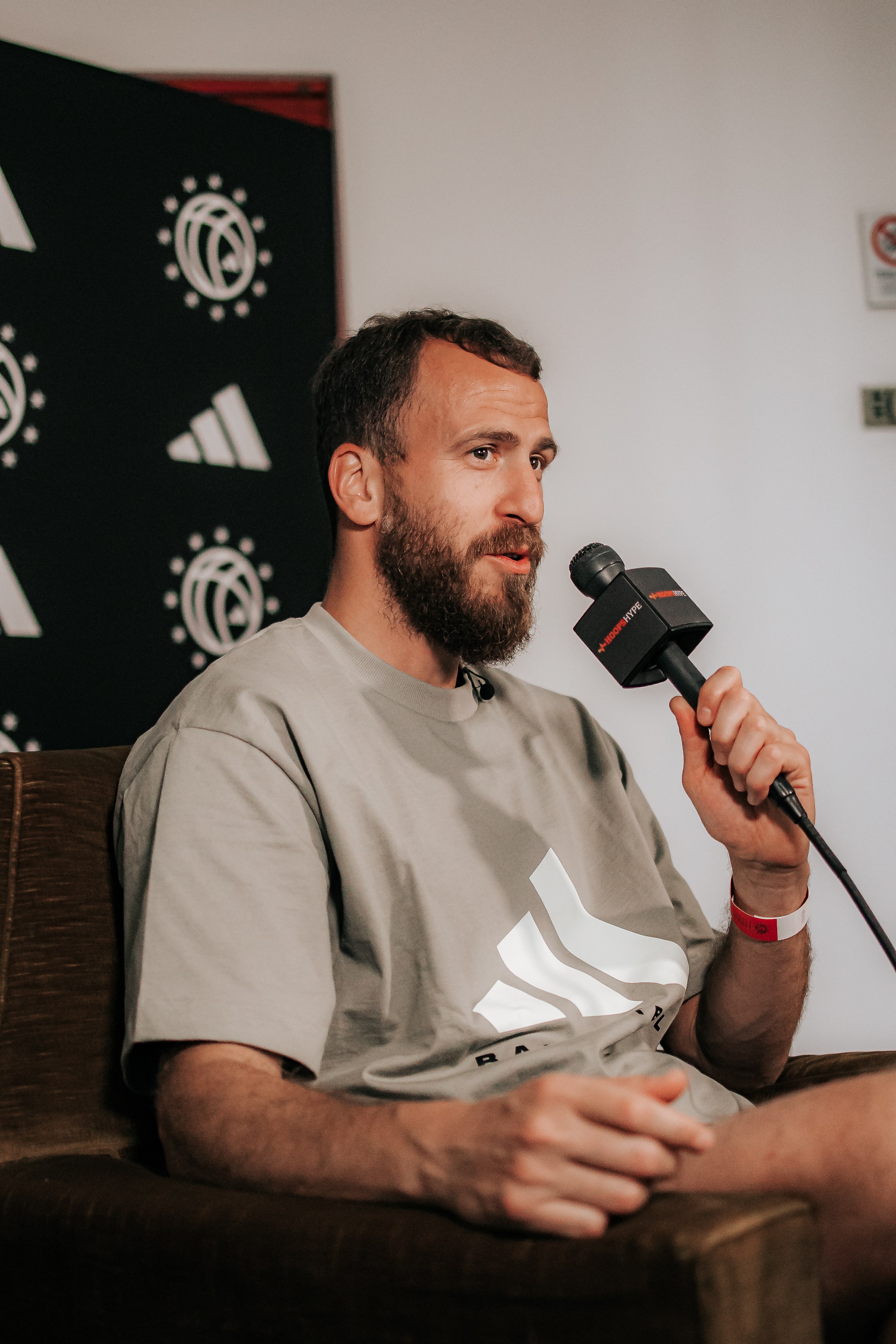 Basketball coach or scout speaking in an interview at adidas Eurocamp 2025